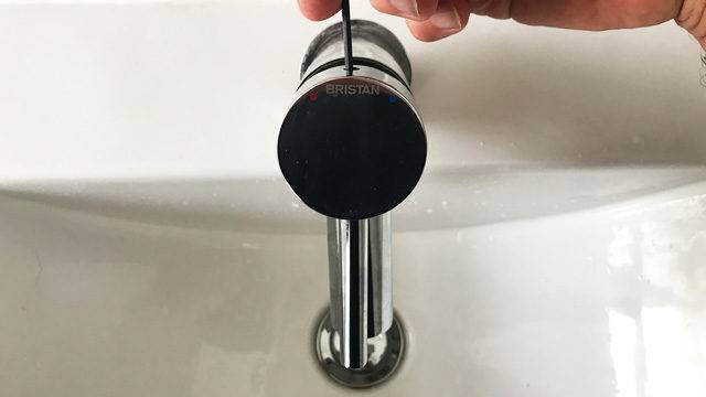Unscrewing the mixer tap head